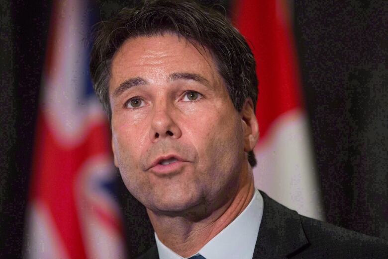 Ontario Health Minister Eric Hoskins speaks during a news conference after the first day of a meeting of provincial and territorial health ministers in Vancouver, B.C., on January 20, 2016. Hoskins has announced he is resigning from his post. 