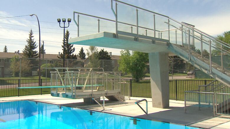 A diving platform and springboard are pictured at an outdoor pool in Calgary.