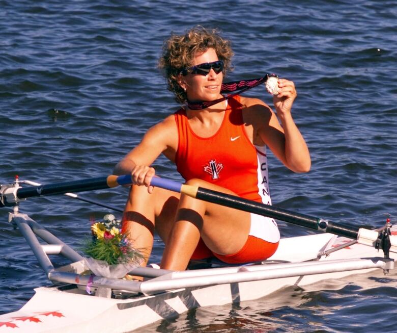 Canadian rower Marnie McBean, shown here with her 1999 Pan Am Games gold medal, has been named Canada's chef de mission for the 202 Tokyo Olympics.