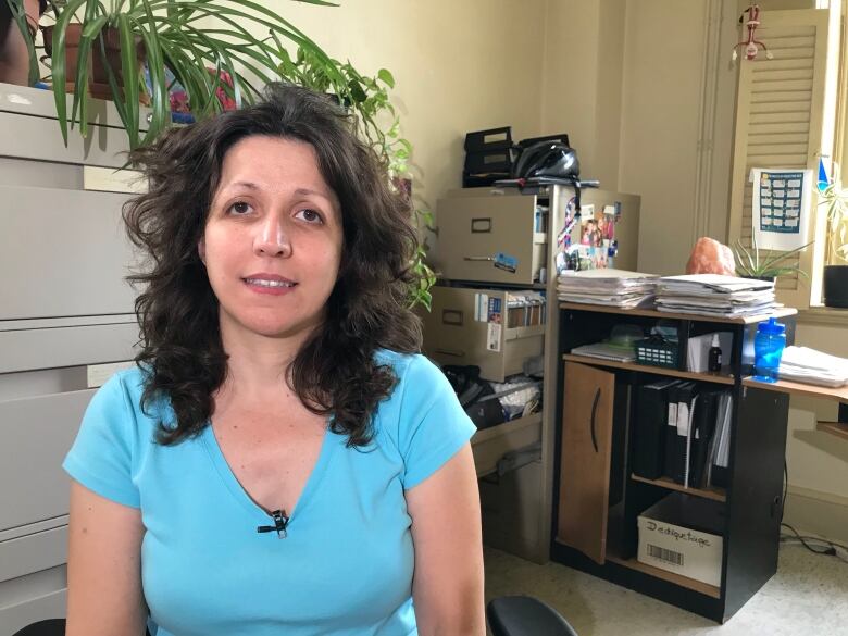 A woman sitting in an office