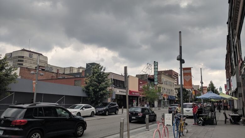 Dark storm clouds over a downtown core