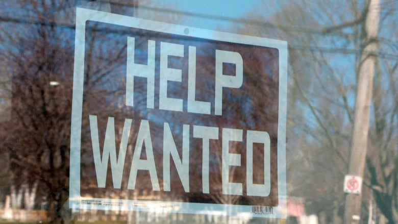 A Help Wanted sign.