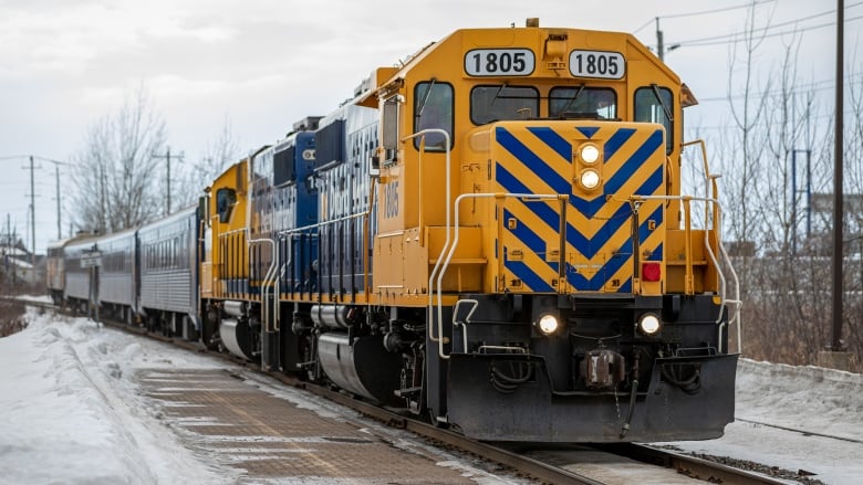 A yellow and blue locomotive. 