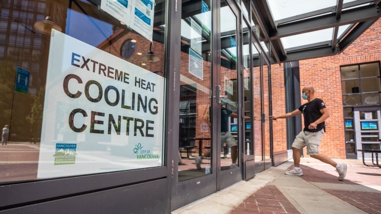 A man heads into a cooling centre set up by the City of Vancouver to help people stay cool during extreme heat. 