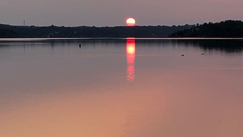 Red sky over a lake during sunset