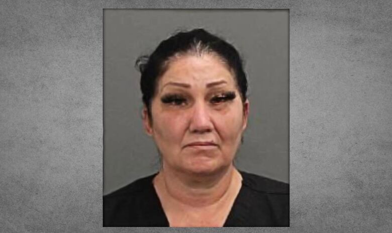 Brigitte Cleroux looks neutral in a mugshot. She is an Indigenous woman wearing black.