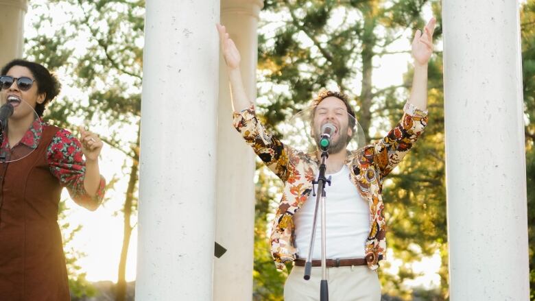 A man singing at a microphone.