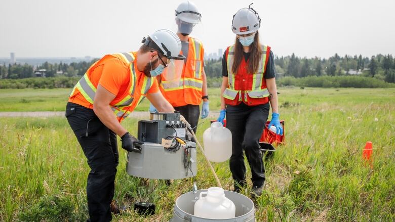 University of Calgary researchers check monitoring equipment as they track traces of COVID-19 in the wastewater system in  Calgary, Alta., Wednesday, July 14, 2021.