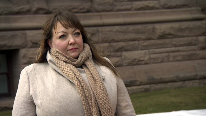 Close up photo of Natalie Mehra wearing a jacket and scarf. 