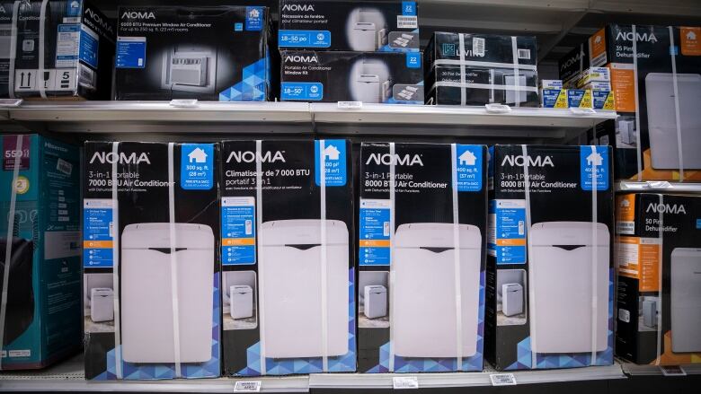 Rows of Noma-brand AC boxes in a store.