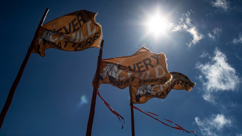 Orange flags that read 