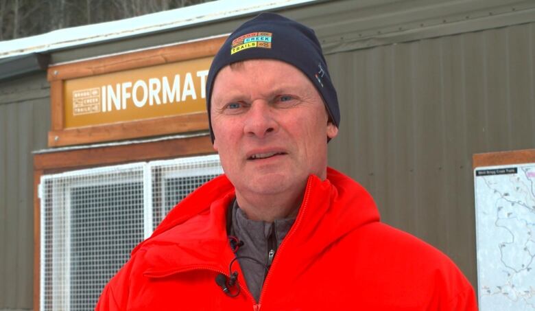 Bragg Creek Trails president Conrad Schiebel stands in front of the group's information centre in a file photo from Decemer 2022. 