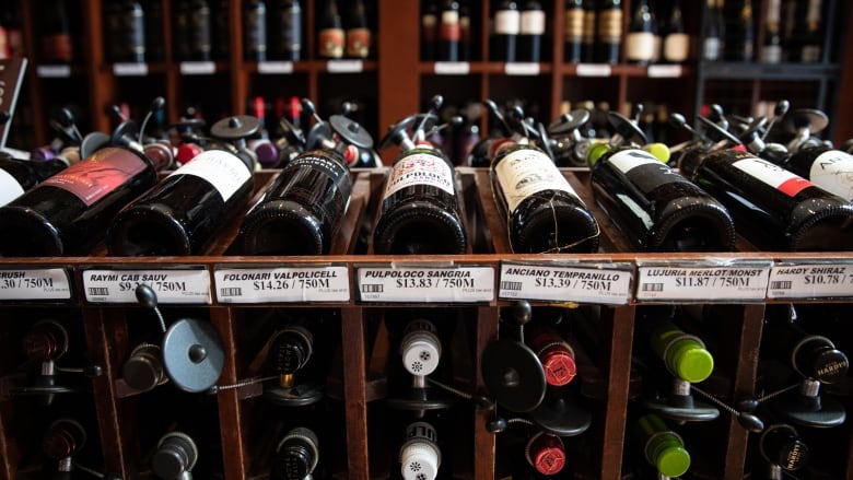 A row of red wine bottles are seen on display inside a store in Vancouver.