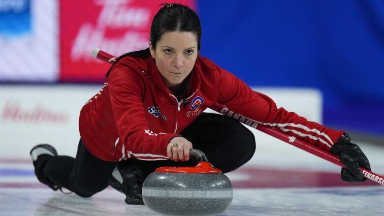 Team Canada skip Kerri Einarson delivers a rock with her right hand while playing Saskatchewan at the Scotties Tournament of Hearts.