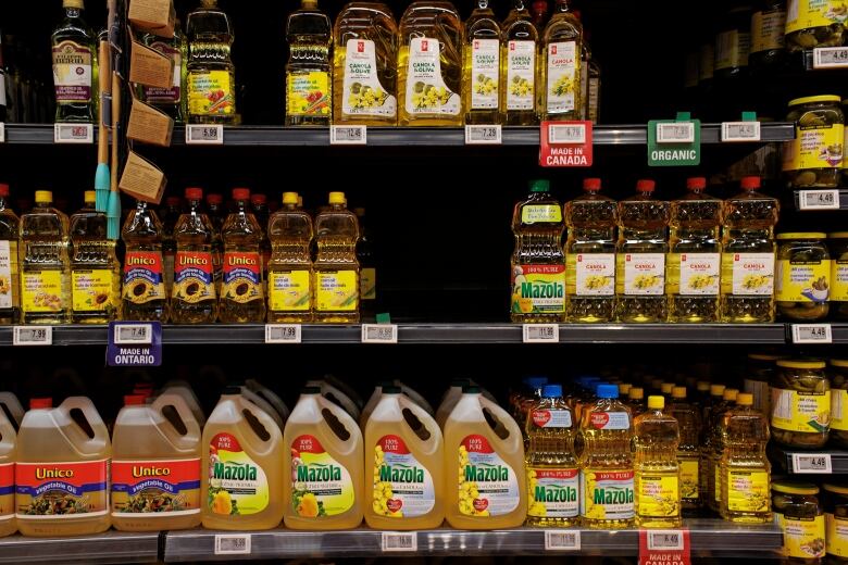 A vegetable oil aisle at a grocery store.