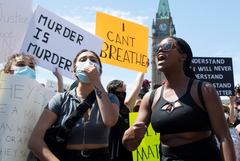 Protestors chant near the Parliament building during a Black Lives Matter protest.