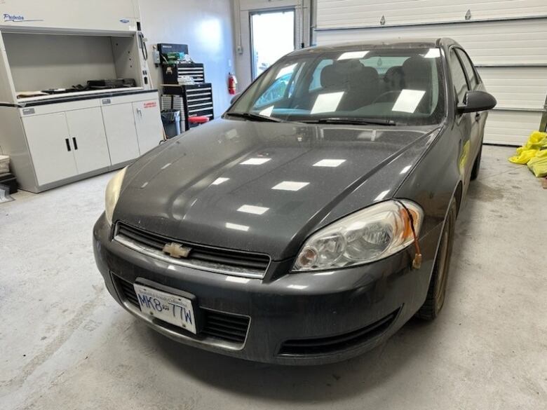 A grey Chevrolet Impala car.