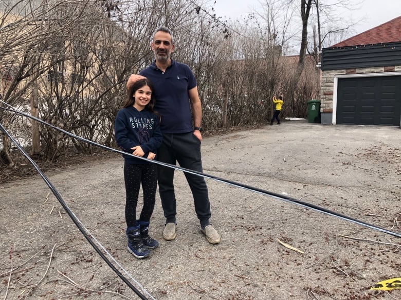 Man and girl with a wire. 