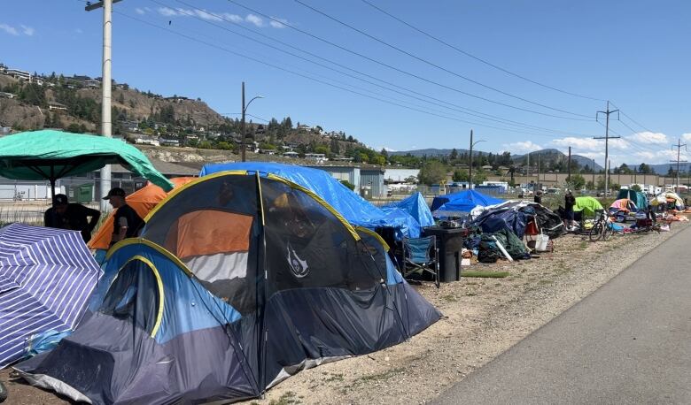 Tents along a road.