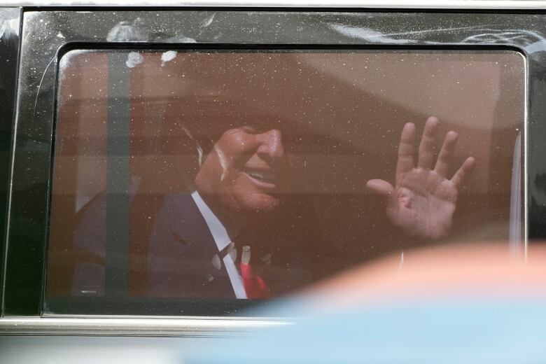 Trump seen through window