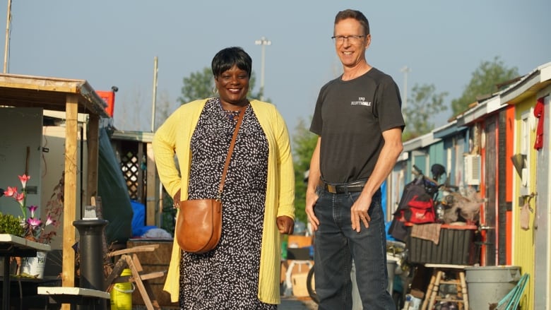 A photo of two people standing side by side.