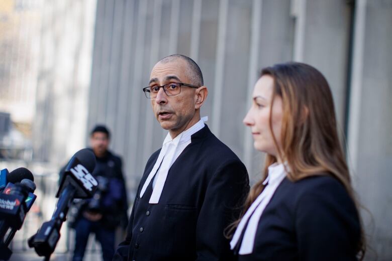 Crown Attorneys Neville Golwalla and Ana Serban speak to  reporters after the trail of former fashion executive Peter Nygard, in Toronto, on Nov. 12, 2023. Nygard was found guilty of  four counts of sexual assault.