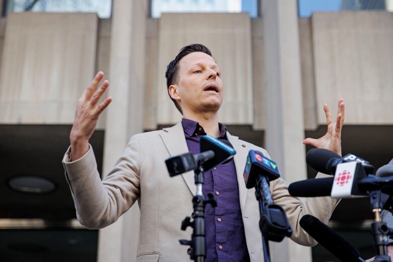 Kai Nygard, one of Peter Nygards sons, speaks to members of the press after his father was found guilty on four counts of sexual assault in a Toronto courtroom on Nov. 12, 2023. 