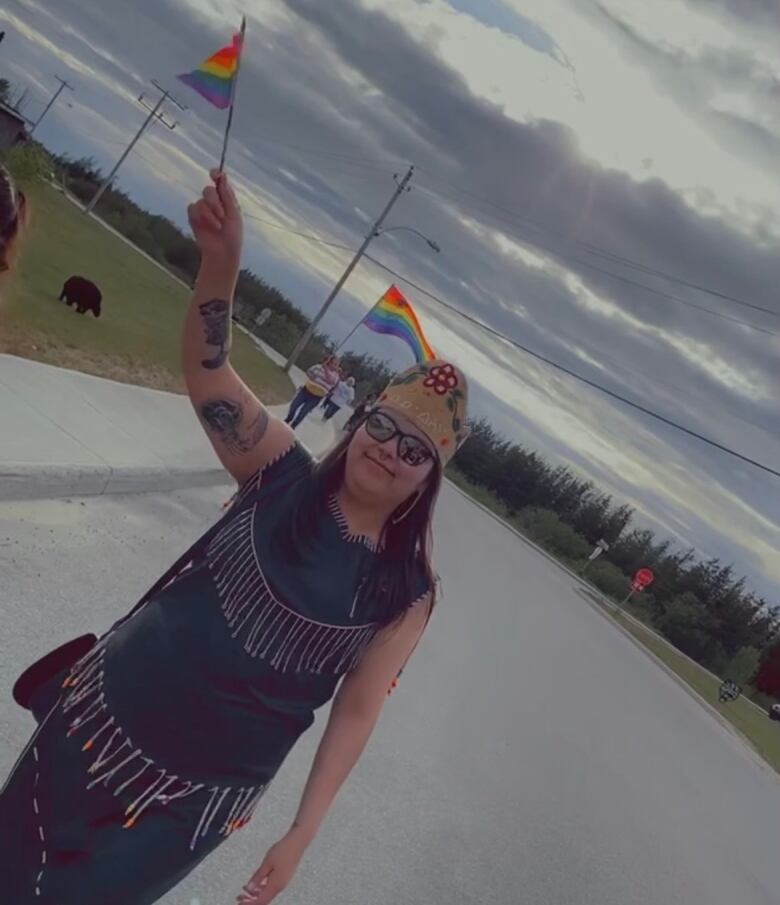 A two-spirit princess walking a pride parade.