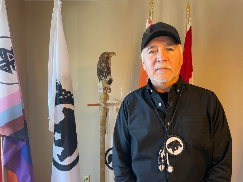 A First Nations chief poses for a photo.