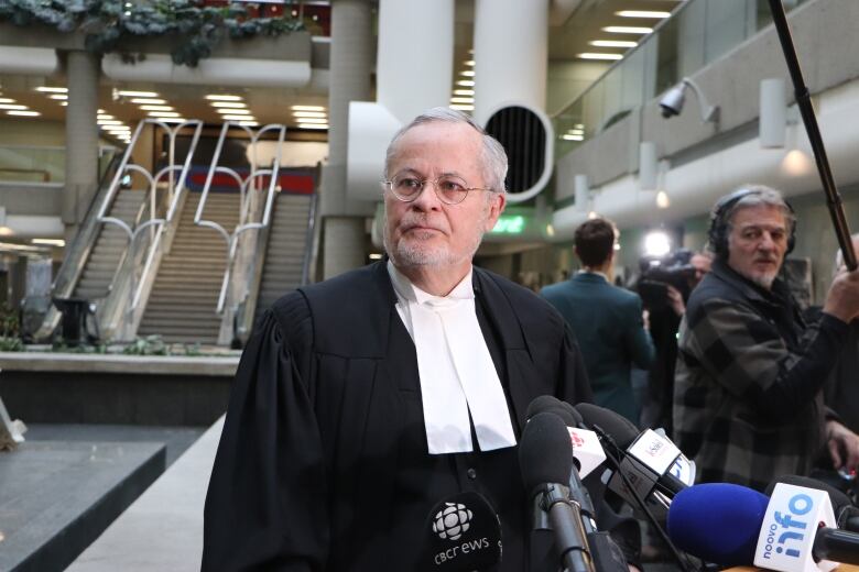 a lawyer standing in a courthouse.