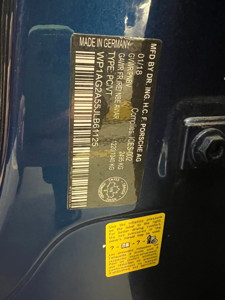 A fake vehicle identification number on a blue Porsche.