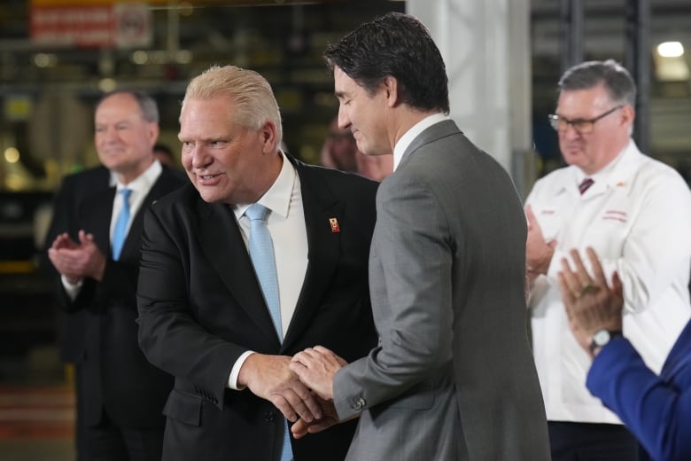 Doug Ford and Justin Trudeau shake hands