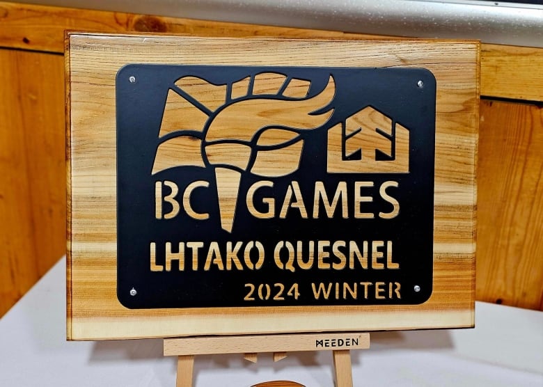 A sign that reads Lhtako Quesnel 2024 Winter Games