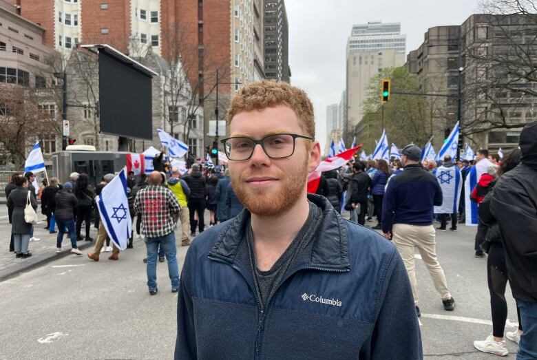 a man with red hair and glasses