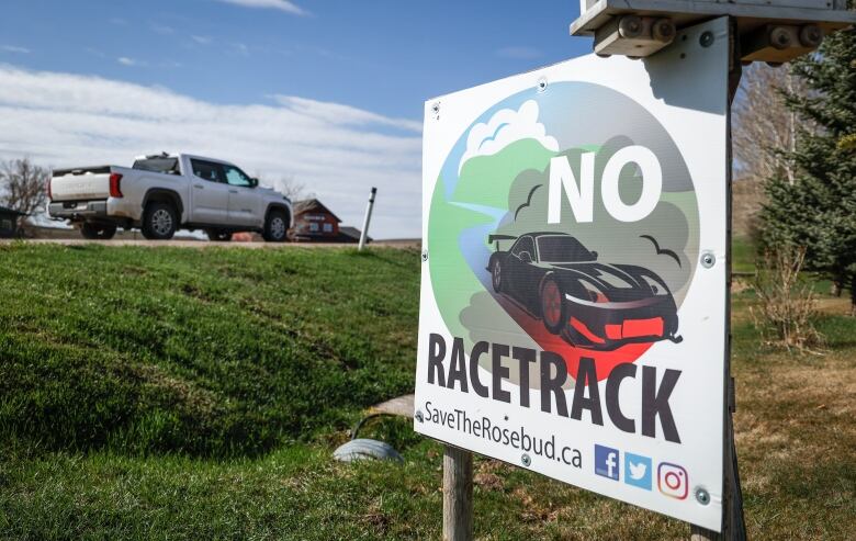 A No Racetrack sign near a country road.