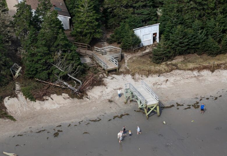 A boardwalk that has been broken by storm Lee is shown in a photo from above after the storm last September.