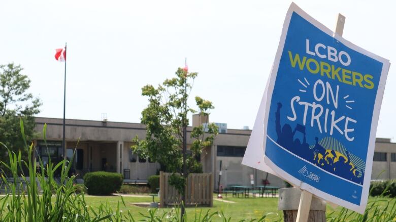 A picket sign leaned against the fence that surrounds the LCBO's London Logistics Facility on Monday, just metres away from striking workers.