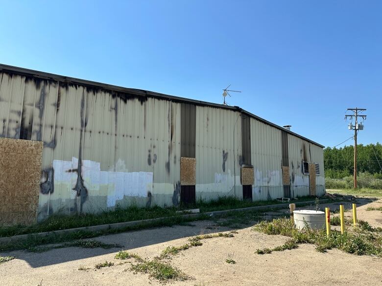 A building shows fire damage.