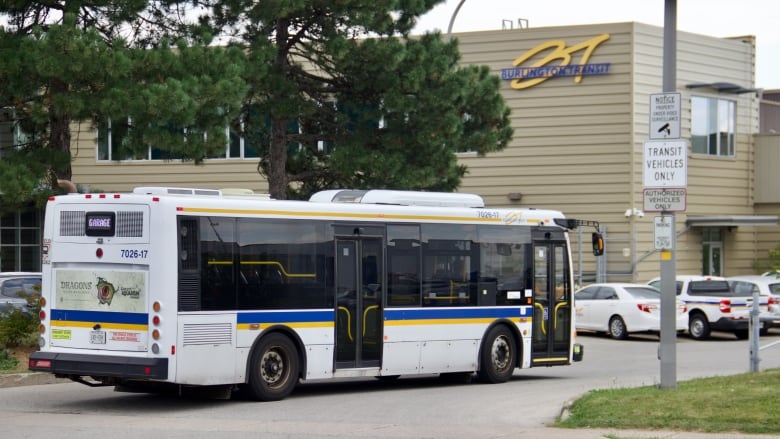 A bus with a Burlington Transit building in the background