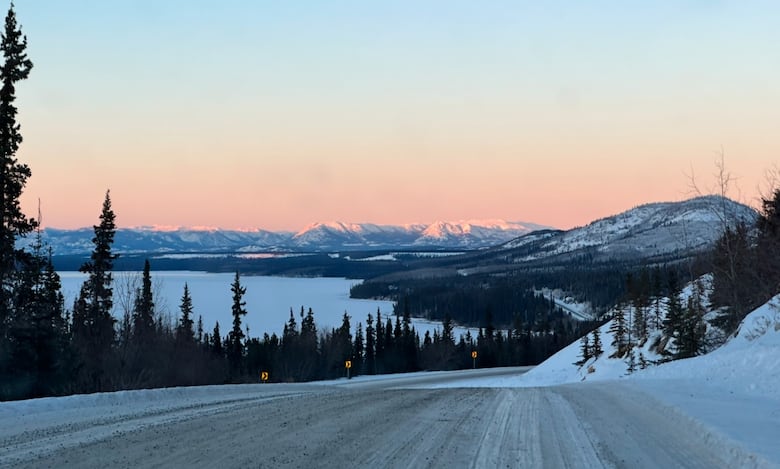 gravel road in winter at sunset